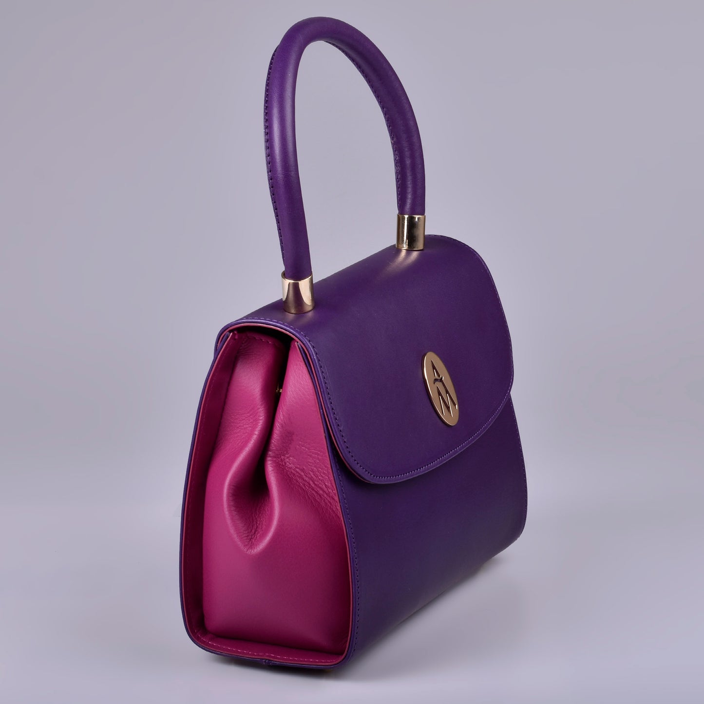 bolso piel morado y fucsia